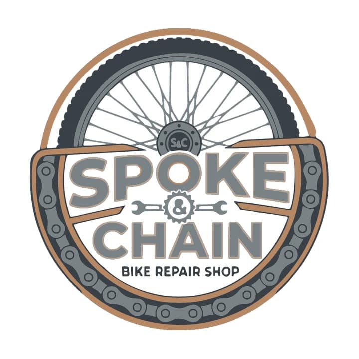 Trace of the edited badge: clean tan rim, tyre, chain, spokes and lettering, with a lumpy ampersand in the gear
